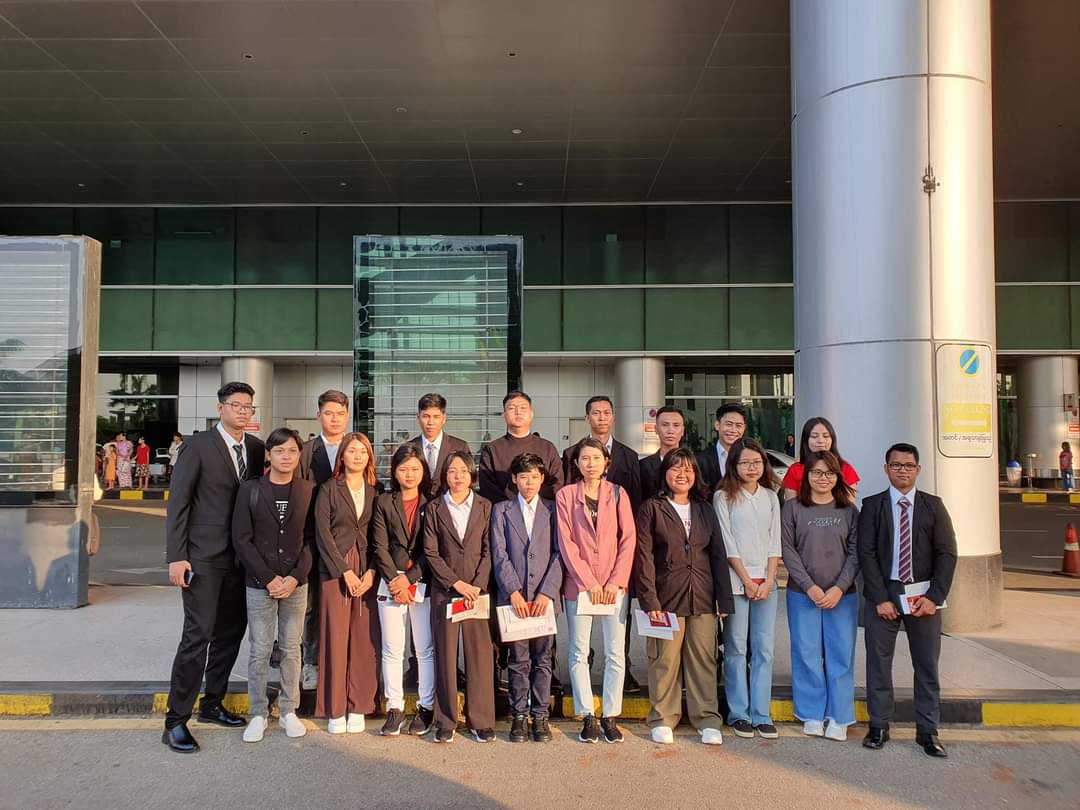 Bagan Time candidates gathered outside the airport before departure